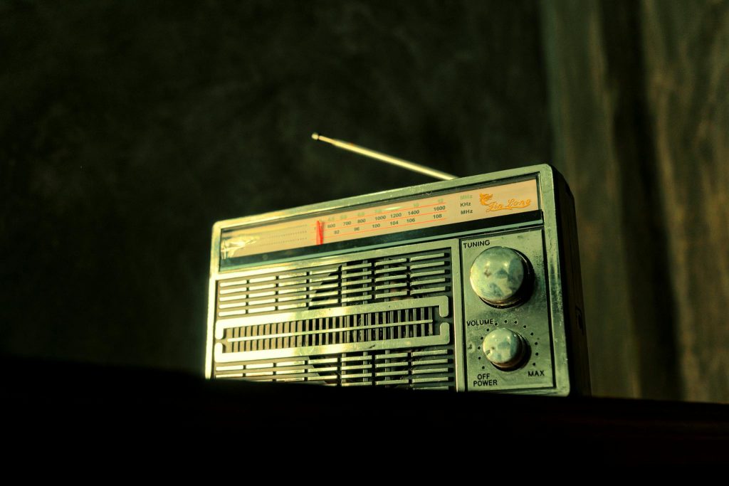 A nostalgic vintage radio with visible tuning dial, evoking classic charm.